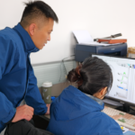 engineers reviewing 3D model of a medical endoscope cart during product development