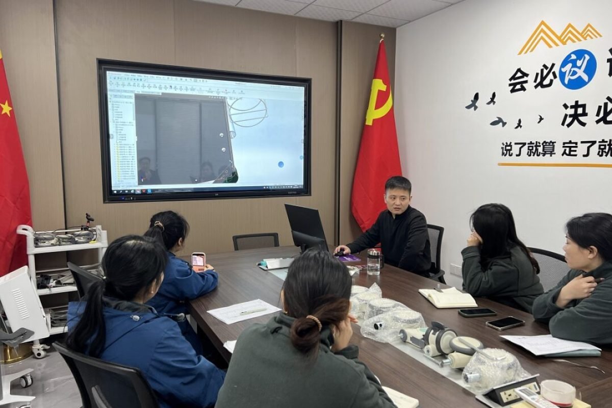 engineering team discussing medical endoscope cart design development